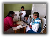 Juanita shares the gospel with a family - Chaupiloma, May 29, 2018