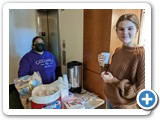 Silvia offering snacks and hot chocolate to attendees